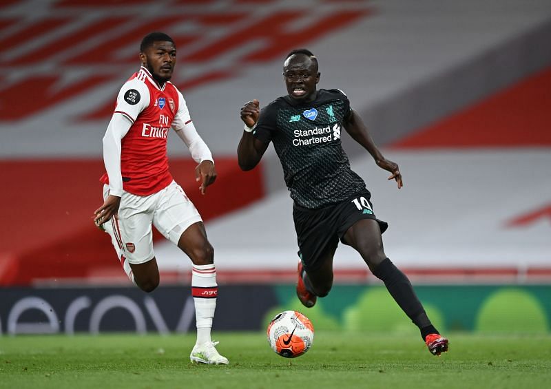 Sadio Mane of Liverpool breaks away from Ainsley Maitland-Niles (left) of Arsenal.